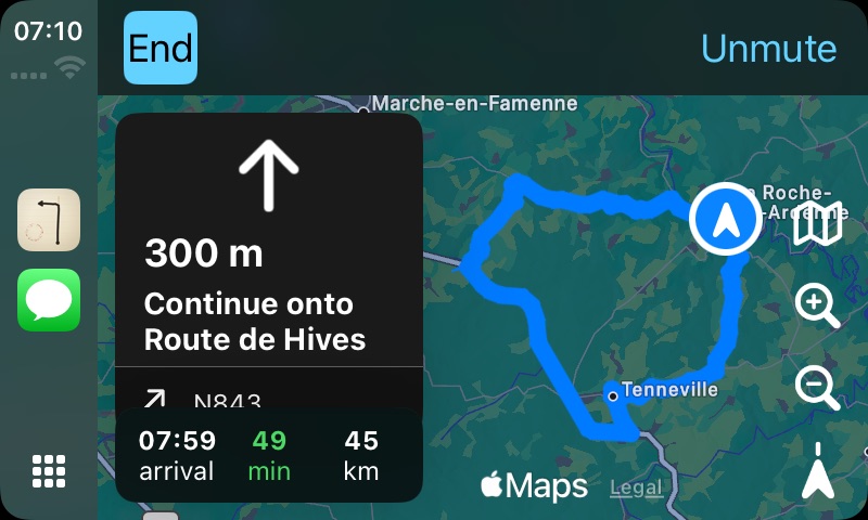 The Roadbook '71 CarPlay screen while driving: a maneuver panel showing 300 m and “Continue onto Route de Hives”, the next instruction below it, then arrival time 07:59, 49 minutes and 45 km remaining, over the car's map with the whole loop drawn in blue.