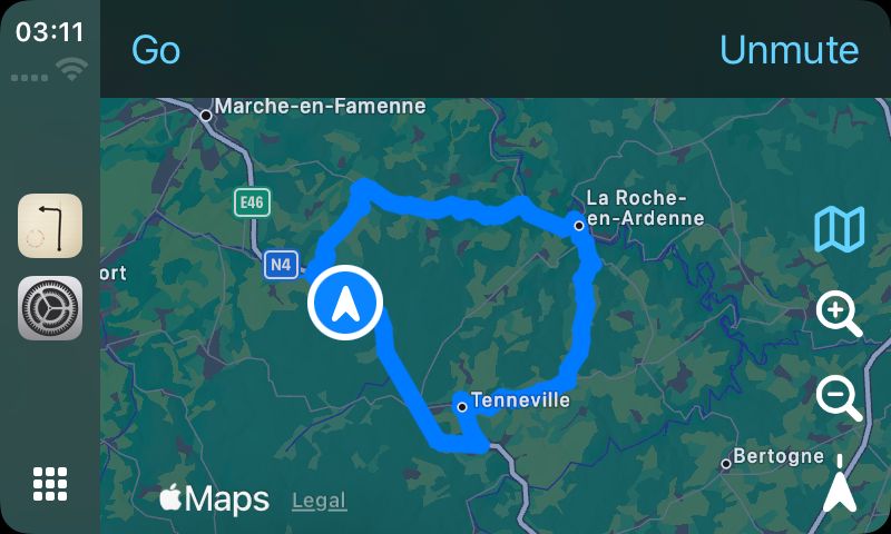 The Roadbook '71 CarPlay screen before setting off: the whole Ourthe Circuit loop drawn on the car's map between Marche-en-Famenne, La Roche-en-Ardenne and Tenneville, with the car's own position marked beside the ring.