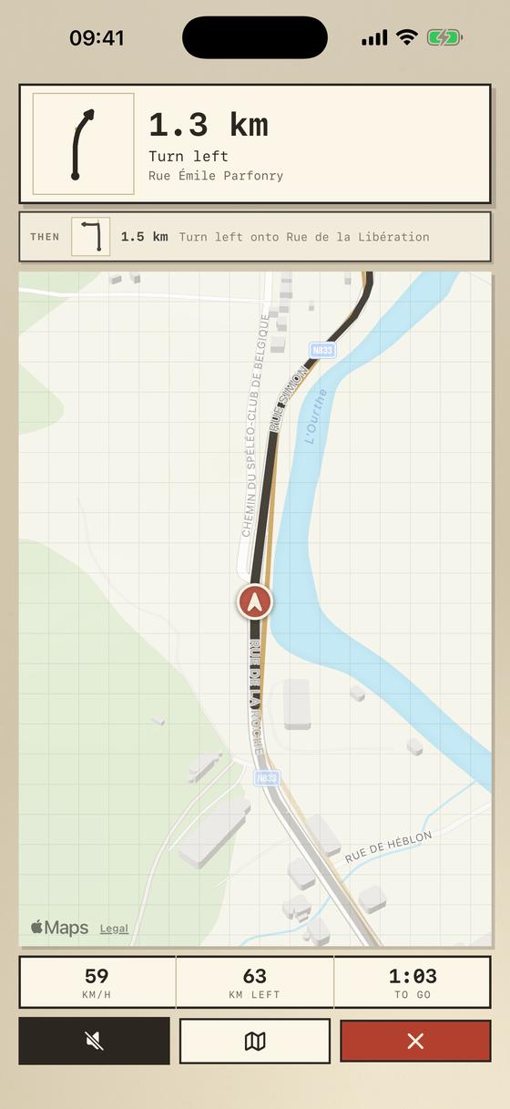 The driving screen: the next instruction with its tulip, the distance to the turn, and the heading-up map below.